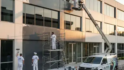 Professional commercial painters finishing exterior building in Bakersfield, CA